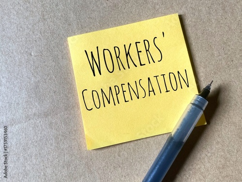 Yellow sticky note with the words Workers' Compensation written on it in bold, black capital letters.