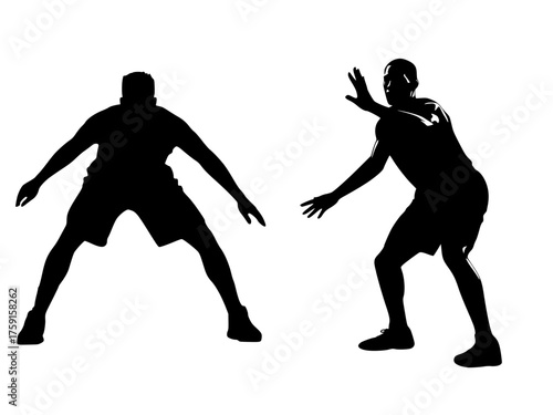 Basketball Players in Defensive Action