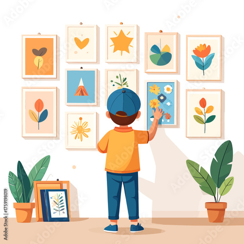 Young boy admiring a wall filled with colorful framed illustrations of plants and abstract art.