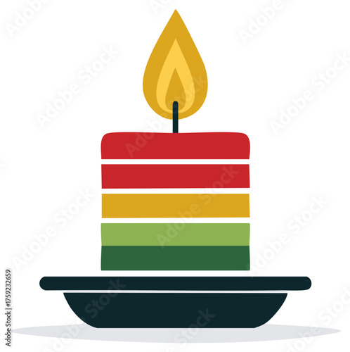 Colorful striped candle with burning flame for Kwanzaa or Christmas holiday celebration