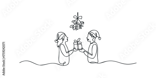 Couple exchanging gift under mistletoe