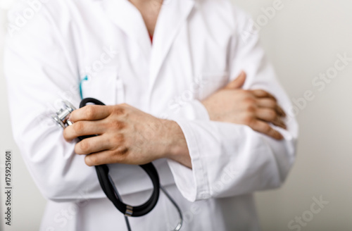 A doctor in a white coat ho...
