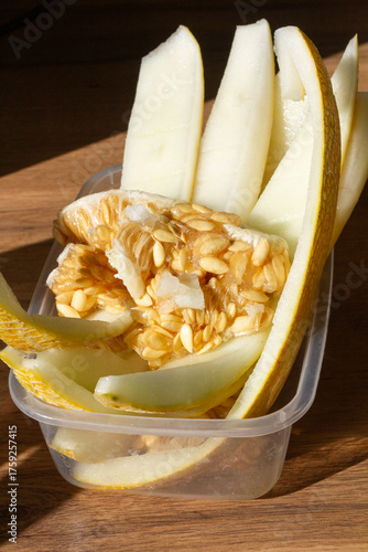 melon peel with seeds in the container, peeled melon waste