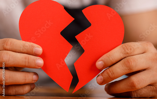Hands holding a torn paper ...