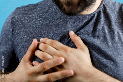 Close-up of a man holding h...