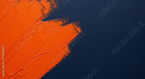 Vibrant orange paint brush strokes artfully applied across a deep navy blue textured canvas creating a bold abstract composition with dynamic texture