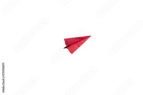 Single, bright red paper airplane isolated against a solid, deep black background