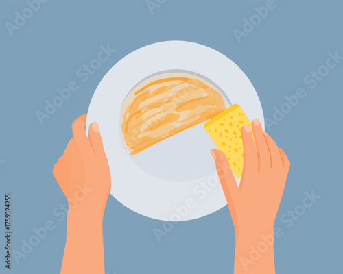 Hand washing dishes with a sponge
