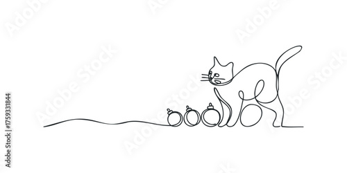 Playful cat interacting with festive ornaments