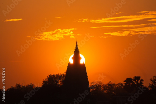 India, Bihar, Bodh Gaya, Beautiful Sunset over the  Sacred Mahabodhi Temple, Sun Going Down Align With Monuments.
