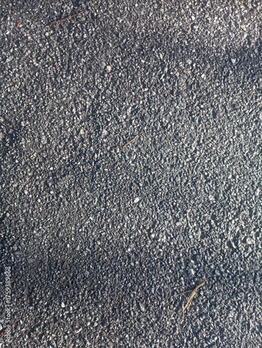 macro texture of asphalt with medium grain, detailed surface, realistic lighting, sharp focus, top view