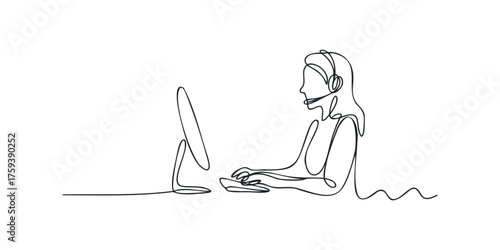 Operator typing on computer keyboard wearing headset