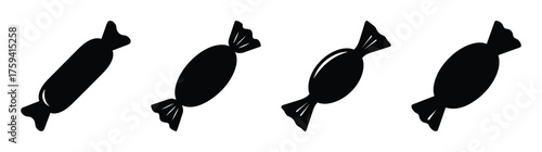 Fourblackwrappedcandiesinarowdisplayingfestivesweettreatsandconfectionerydelights