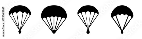 Fourstylizedblackparachutesdescendingwithvariousattachedobjectsforskydivingandaerialdelivery