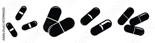 Multipleblackmedicinecapsulesscatteredandgroupedtogetherhealthcaremedicalpharmacypharmaceuticaltreatmentconcept