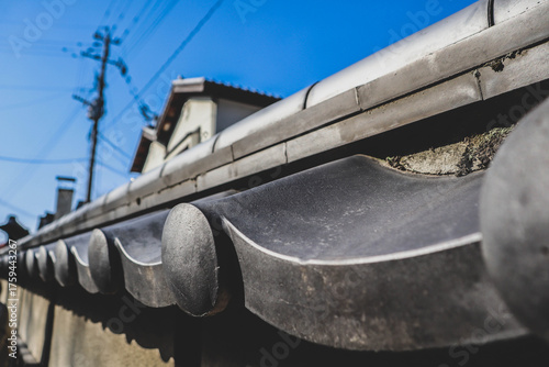 Close-Up of Traditional Japanese Kawara Roof Tiles and Blue Sky.
