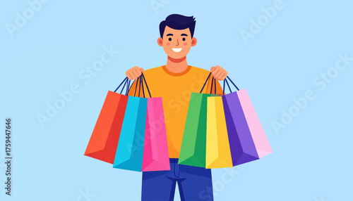 A smiling young man holding many colorful shopping bags in both hands.