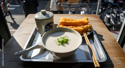 Delicious traditional Taiwanese breakfast with soy milk and fried cruller on a table