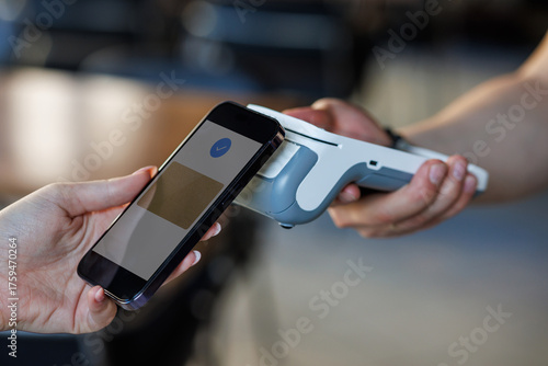 Contactless smartphone payment at POS terminal — tap to pay mobile wallet in retail