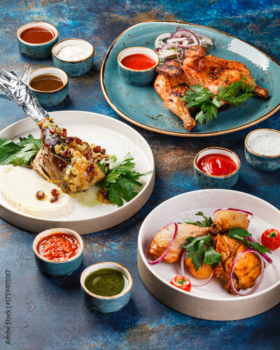 Tablou pe pânză Several dishes of chicken and lamb, with herbs and sauces