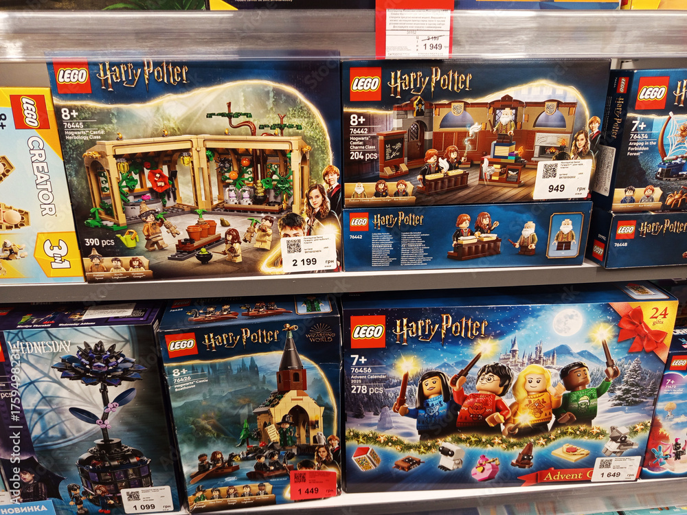 Fototapeta premium Zvyagel, Ukraine - October 15, 2025: LEGO Harry Potter themed building sets displayed on store shelf, showcasing various characters and scenes from the popular wizarding world franchise