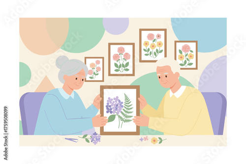 Happy seniors creating pressed flower art enjoying a creative hobby together Leisure and craft