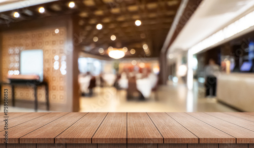 Wallpaper Mural Empty wooden table top with lights bokeh on blur restaurant background. Torontodigital.ca