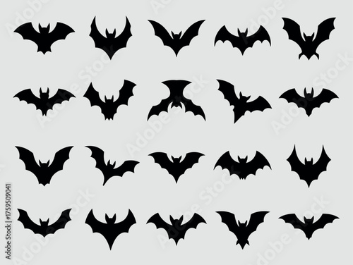 Collection of silhouetted bats in various flying poses