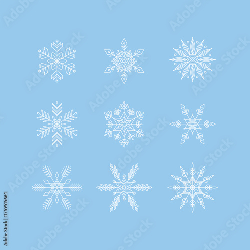 Nine white snowflake designs on light blue background isolated on white background