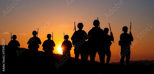 Silhouetted soldiers stand at sunset, rifles lowered, signifying peace, stillness, arms