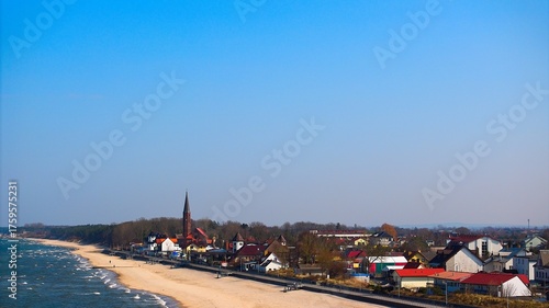 Fototapeta Naklejka Na Ścianę i Meble -  Tranquil Polish Baltic coast, Sarbinowo and smooth sea under sunlight.