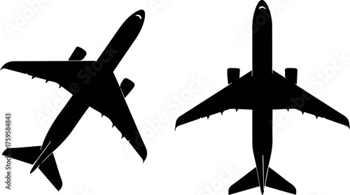 Two black silhouette passenger jet airplanes flying against a white background viewed from above