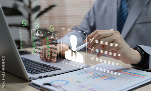HR verification and candidate approval concept. Human resource manager using digital technology to verify identity, review resumes, and manage recruitment profiles in an automated system.