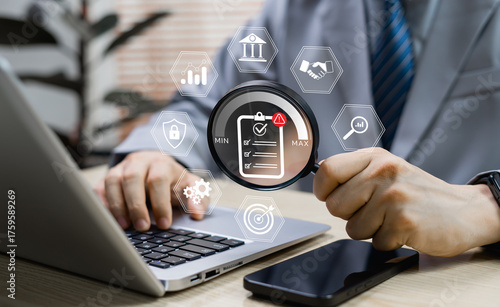 Risk management and business planning concept showing businessman evaluating risks with virtual digital indicators, highlighting strategy, opportunity assessment, and risk control.