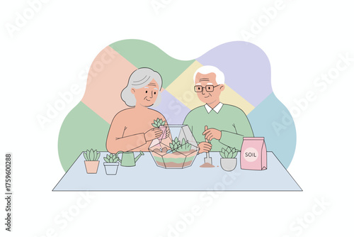 Happy senior couple planting succulents together in a terrarium at home enjoying a hobby