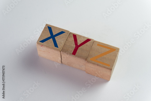 Concept of Generations X, Y (Millennials), and Z. Wooden blocks with letters XYZ representing the different demographics, the modern workforce, marketing, and social change.