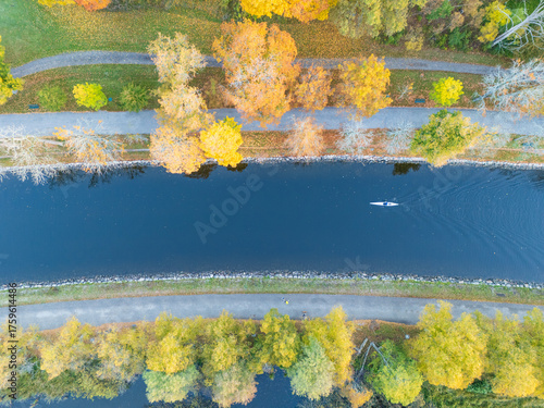 Canvas Print Vertical view of a person in a kayak in a canal near Stockholm, Sweden, with vib