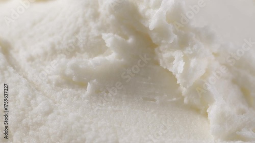 Macro view of raw shea butter texture, creamy and soft, styled close for skincare cosmetic ingredient photography concept.