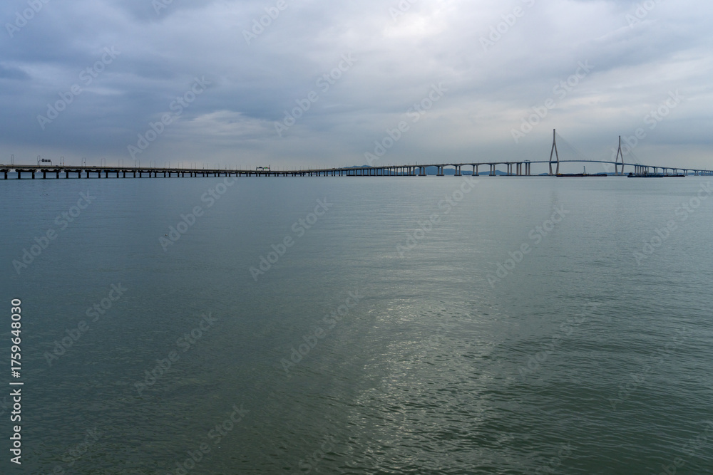 Fototapeta premium idyllic seascape with a long highway bridge