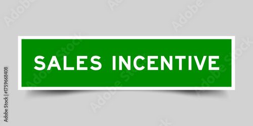 Green color square shape sticker label with word sales incentive on gray background