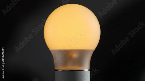 A glowing, green-lit bulb is captured on a dark, sleek background, showcasing its vibrant illumination