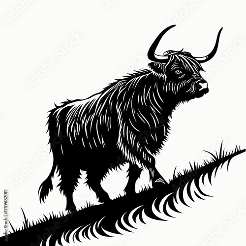 Black silhouette of a bull on a grassy hill