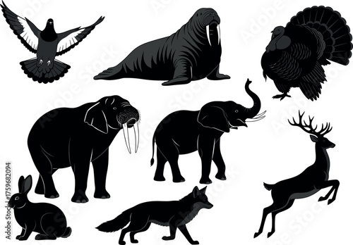 Silhouette set of wild and domestic animals including fox, elephant, saber-toothed cat, pigeon, deer, rabbit, and more