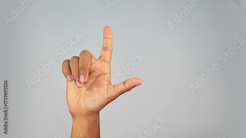 Hand Gesture Showing L Sign — Loser Gesture Close-Up on Studio Background