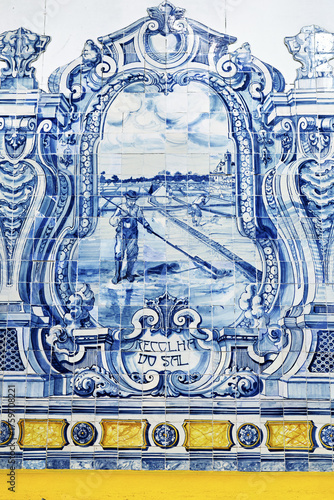 wall mural ceramic tiles, known as azulejos,  with scenes of ships, buildings, and coastal landscapes. The mural includes maritime imagery in Mercado do Livramento in Setubal, Portugal
