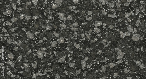Dark asphalt with light aggregates possibly wet textured surface