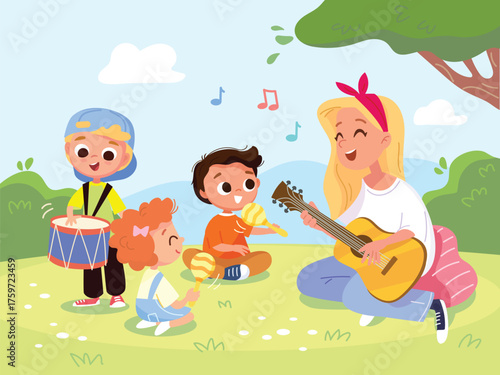 Music teacher leads music class for toddlers on park meadow. Mother plays guitar and sings song for her children sitting on the grass. Children and caregivers spend quality time together in nature.