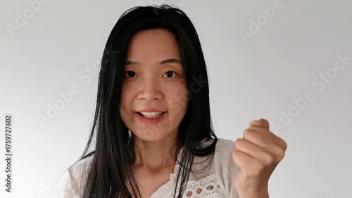 Woman with Raised Fists: Cheering for the Game, Encouragement in Motion