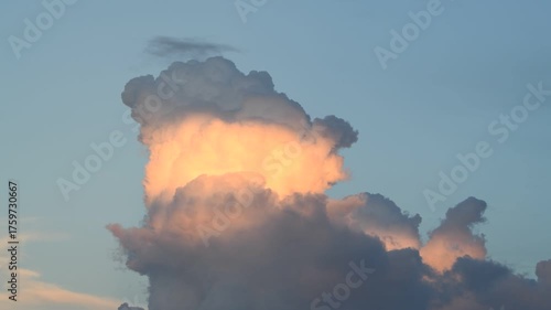 Sunset Illuminating a Powerful Storm Cloud - Golden Light Emerging from the Storm