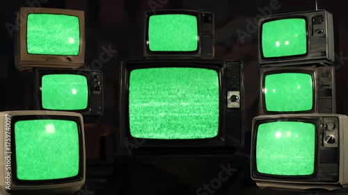 Stack of Vintage Televisions with Green Screen, Retro Media Concept